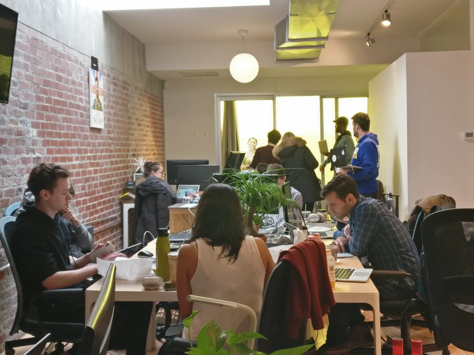 Michael Taylor working with a team in a co-working space