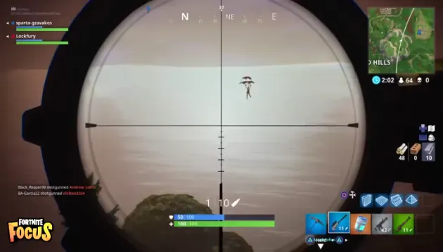 Fortnite screenshot through a sniper scope showing a distant player parachuting over water, with the game HUD and kill feed visible.